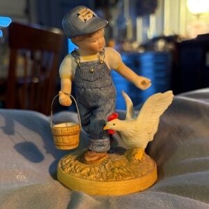 Charming Figurine of Boy with Chicken